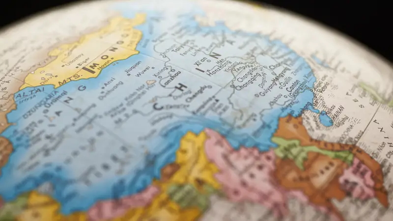 Close-up of a desk globe showing Asia and Europe